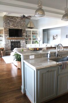 a large kitchen with an island in the middle