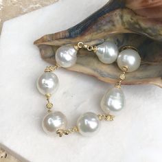 14KT Yellow Gold + Paspaley South Sea Pearl Spacers Bracelet 7, 14KT Yellow Gold + Paspaley South Sea Pearl Spacers Bracelet 7 - Legacy Saint Jewelry Toggle Clasp Bracelet, Clasp Bracelet, Sea Pearl, South Seas, South Sea Pearls, Sea Pearls, Circle Shape, Toggle Clasp, Pearl Bracelet