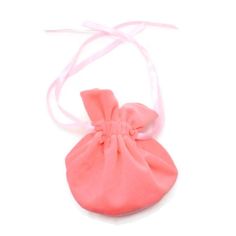 a small bag with a pink bow on it