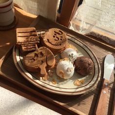 a white plate topped with waffles and ice cream