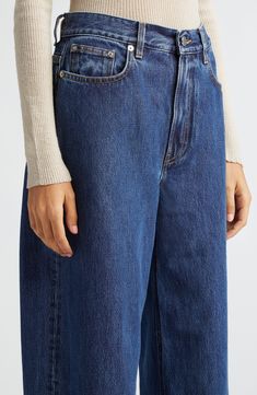 Relaxed yet dramatic, these mid-wash jeans are crafted from nonstretch Italian denim with a high waist and full-length tapered legs. 34" inseam; 17" leg opening; 11 1/2" front rise; 14" back rise (size 26) Zip fly with button closure Front scoop pockets; coin pocket 100% organic cotton Hand wash, line dry Made in Italy Designer Clothing This brand has B Corp certification, representing business practices with emphasis on social and environmental performance, accountability and transparency This Blue Tapered Leg Flare Jeans For Fall, Modern Cropped Tapered Leg Denim Jeans, Modern Cropped Tapered Leg Jeans, Modern Tapered Leg Cropped Denim Jeans, Modern Blue Cropped Leg Jeans, Modern Blue Cropped Jeans, Blue Tapered Leg Cropped Jeans For Fall, Blue Cropped Tapered Leg Jeans For Fall, Classic Dark Wash Tapered Leg Flare Jeans