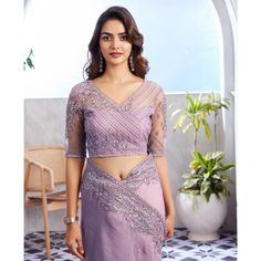 Lavender colored saree is prettified with sequins floral embroidered work as shown which makes it appear classy. This saree is made of Georgette fabric which is accompanied with banglori silk blouse piece which you can customise as per your design/style. Women can buy this saree to wear for their parties, reception and events. Note:- The actual product may differ slightly in color and design from the one illustrated in the images when compared with computer or mobile screen. Measurements: Saree Purple Pre-draped Saree With Zari Work For Reception, Lavender Saree Set For Party, Elegant Lavender Saree Set, Lavender Saree For Party, Purple Dola Silk Pre-draped Saree With Self Design, Elegant Lavender Saree With Dupatta, Lavender Lehenga For Eid Party, Semi-stitched Purple Pre-draped Saree With Cutdana, Lavender Saree Set With Zari Work