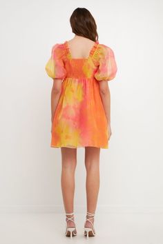 Stand out at your next special event in this stunning tie-dye baby-doll dress. This mini length dress is perfect for showing off your curves. With puff sleeves and shirring detail, this dress is sure to turn heads. The sweetheart neckline gives it a glamorous touch, while the invisible zipper closure makes it easy to wear. Mini length Puff sleeves Tie-dye print Shirring detail Baby doll fit Invisible zipper closure Sweetheart neckline Hand wash cold Do not bleach Do not tumble dry Iron low Shell Flowy Mini Puff Sleeve Dress With Smocked Bodice, Multicolor Mini Puff Sleeve Dress For Summer, Multicolor Puff Sleeve Mini Dress For Summer, Multicolor Mini Puff Sleeve Summer Dress, Casual Tie-dye Mini Dress, Spring Mini Puff Sleeve Smocked Dress, Spring Mini Puff Sleeve Smock Dress, Tie Dye Short Sleeve Dress, Multicolor Smocked Mini Dress For Summer