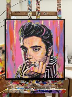 Elvis Presley original painting, by British artist Marie O'Hara. Acrylic and oil with gold leaf and framed in smart black wood. Fixtures on reverse, so is ready to hang in your space. Ideal for Elvis Presley fans.  This painting measures 25 x 25 inches (including frame) and is embellished with gold leaf.  The painting is framed in a premier black wooden frame and is fitted with attachments on the back so the picture is ready to hang. The artist has captured Elvis Presley's charismatic and broodi Elvis Print, Elvis Portrait, Elvis Presley Portrait, Rock Wall Art, Elvis Art, Iconic Artwork, Rock Wall, Hound Dog, Cardboard Tube