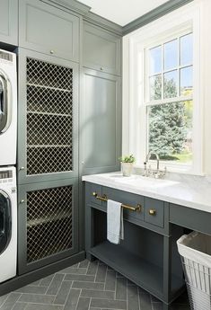 an instagramted photo of a laundry room with washer and dryer in it