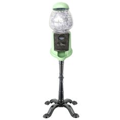 a green and black stand with a light on it's top, in front of a white background