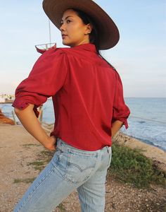 Red blouse with half sleeves. Collared. Button down. Size S. EU 34-38 / UK 6-10 Measurements - 38"/ 97cm bust, 16"/ 41cm sleeve length, 22"/ 56cm shirt length. Material - Polyester. Condition - Excellent. Sustainability - Vintage. Handpicked, repaired and ready to wear. This is an original vintage item, not new and minor signs of wear and age are expected, we will highlight any major flaws. Model is a UK 6/8 and is 5'7" tall. Red Half Sleeve Shirt For Summer, Red Half Sleeve Summer Blouse, Summer Half-sleeve Blouse With Roll-up Sleeves, Summer Half Sleeve Blouse With Roll-up Sleeves, Fall Short Sleeve Blouse With Rolled Sleeves, Fall Blouse With Rolled Short Sleeves, Red 3/4 Sleeve Summer Blouse, Fall Short Sleeve Blouse With Roll-up Sleeves, Summer Blouse With 3/4 Roll-up Sleeves