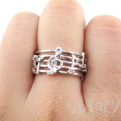 - Description - Details A beautiful music themed ring made in the shape of musical notes on a music score wrapped around your finger to form a band in silver! For more music themed jewelry and product visit our store! Store FAQ | Shipping Info | Returns & Exchanges Size: Available in US size 4 to size 7! Please select your ring size using the drop down menu! Material: Silver Plated Brass, Rhinestones Music Themed Jewelry, Music Note Ring, Music Rings, Tv Girl, Musical Jewelry, Music Jewelry, Dream Gift, Beautiful Music, Musical Notes