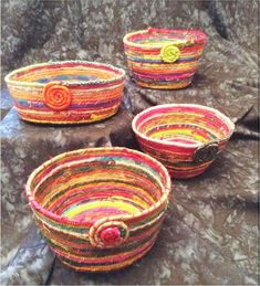 three woven baskets sitting on top of a table