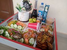 a tray filled with lots of food and drinks