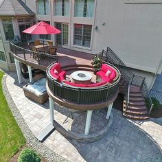 an aerial view of a house with patio and hot tub