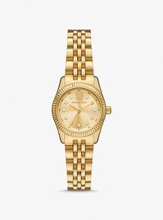 The Lexington watch exudes everyday glamour with its gold hue and sparkling pavé accents. Made entirely of stainless steel, this mini timepiece boasts a round face with a beveled topring and a matching bracelet strap. Slip it on to give both day and night outfits a dose of sophisticated charm. Hailey Bieber Rolex Watch, Womens Watches Gold, Chanel Bracelet Gold, Jewerly Stacks Gold, Gold Bracelet Watch, Old Money Wishlist, Women’s Gold Watch, Watch Women's Classy, Michael Kors Watches Women