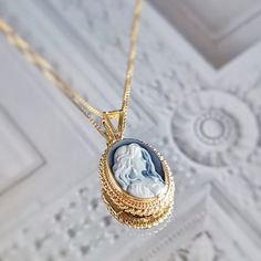 Introducing the Annie Mae necklace! Suitable for one who is truly wild and free at heart.  Featuring a blue agate cameo necklace framed with a golden silver sterling 925 textured frame and chain. Total necklace length: 44cm Cameo pendent: 1 X 1.5 cm AVAILABLE ALSO IN SILVER! Check out our Cameo Necklaces section! Design: a lady with long loose hair, gazing romantically. Shape: Oval. Agate is a variety of banded Chalcedony, which is a variety of the mineral Quartz, known for helping you express y Annie Mae, Italy Gift, Golden Necklace, Silver Pearl Necklace, Cameo Jewelry, Cameo Necklace, Blue Agate, Bridal Necklace, Gorgeous Necklaces