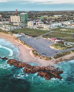 an aerial view of the beach and city