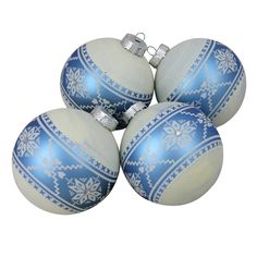 four blue and white christmas balls with snowflakes on them, all in the same pattern