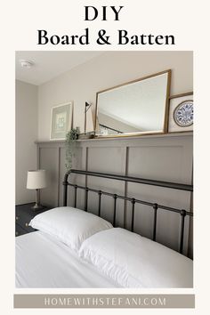 there is a bed with white sheets and pillows on the headboard in this bedroom