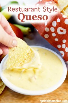 a person dipping quesadilla into a white bowl