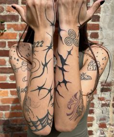 a woman with tattoos covering her arms