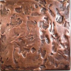 a close up of a square shaped chocolate cake