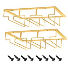 three gold metal shelf brackets with screws on each side and four black screws in the middle