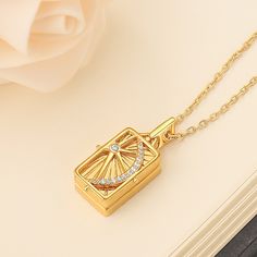 With its eye-catching gold color, this custom  photo necklace incorporates the elements of the sun, moon and stars, signifying a radiant, never-ending stream of true emotions. The unique design allows you to stand out from the crowd as if you were carrying a cosmic star. What's more, the custom locket necklace slides open to reveal two customized photos of yourself, making your precious memories visible at all times. This photo necklace is not only a fashion accessory, but also a precious story Luxury Gold Necklace With Compass Design, Elegant Gold Necklace With Compass Design, Elegant Compass Pendant Necklace, Sun Moon And Stars, Photo Locket Necklace, Sun Moon Stars, Photo Necklace, Round Necklace, Photo Locket