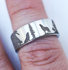 This is a special hyper detailed version of our twin wolf ring that can be seen here: https://www.etsy.com/listing/962130193/animal-landscape-scene-wolf-wolves-ring This engraving is gray to light gray in color instead of black and allows for a coin-like feel to the details of the engraving.  Please note that the details are very small and subtle, the photos provided are very zoomed in.  This is a perfect ring for someone that seeks a subtle, super detailed engraving while still maintaining a cl Wolf Ring, Japanese Wedding, Wolf Jewelry, Laser Engraving Machine, Wolfram, Classic Ring, Perfect Ring, Promise Rings, Laser Engraving