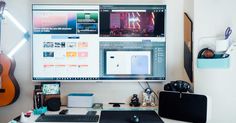 a desktop computer monitor sitting on top of a desk next to a keyboard and mouse