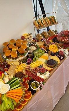 a buffet table filled with lots of different types of food on it's sides