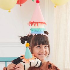 These fabulous hats are perfect for little kids and pets – ideal for adorable Instagram pictures! The bright colors, on-trend fringing and fun pompoms, will instantly put your guests in the party mood! They are ideal for a circus party, birthday party, or any celebratory occasion. Crepe paper fringing Pompoms in bright colors Shiny gold round metallic elastic Suitable for ages 3+ Packaging made using sustainable FSC paper Pack of 8 in 8 colors Product dimensions: 2.25 x 4 inches Pack dimensions: Mini Party Hats, Meri Meri Party, Animal Themed Birthday Party, Animal Candles, Cake Wraps, Animal Parade, Birthday Garland, Kids Dress Up, Meri Meri