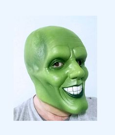 a man wearing a green mask with his face painted to look like he is smiling