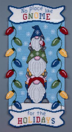 a cross stitch christmas card with an image of a snowman