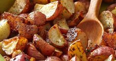 the potatoes are cooked and ready to be eaten with wooden spoons on the side