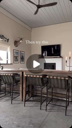 a dining room table with four chairs and a tv on the wall above it that says, then try this