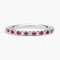 a white gold band with pink and white diamonds