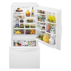 an open refrigerator and freezer combo with the door wide open to reveal its contents