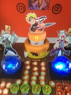 a birthday cake and decorations for a cartoon character themed child's birthday party on a table