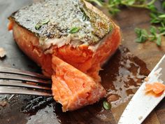 salmon on a plate with a fork next to it and the caption says sous die salmon