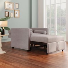 a living room scene with focus on the chair and footstool