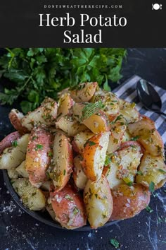 a plate full of potatoes with herbs and parsley in the background text overlay reads herb potato salad