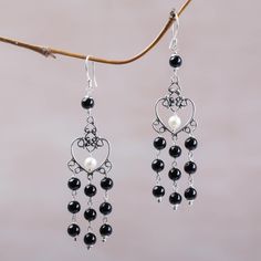 Falling from the ears with an elegant grace cascades of dyed black onyx stones are featured in this pair of chandelier earrings from Bali. Made Sugi designs the earrings handcrafting them of sterling silver in the shape of spiraling hearts to house petite cultured pearls with an elegant glow. Pearl Chandelier Earrings, Pearl Chandelier, Silver Chandelier Earrings, Black Onyx Stone, Heart Shaped Earrings, Sterling Silver Dangle Earrings, Cluster Earrings, Onyx Stone, Leaf Pendant