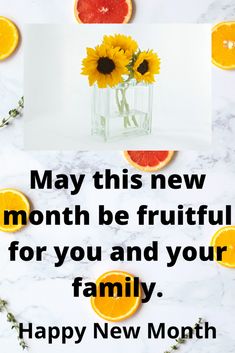 a vase filled with sunflowers next to sliced oranges and watermelon