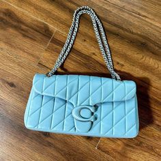 Brand New Authentic Coach Quilted Tabby Light Blue Leather Shoulder Bag With Chain Adjustable Handles. Multiple Compartments, Magnetic Closure. Comes With Tag, Does Not Come With Dust Bag Or Box. New Condition, Never Used. Brand: Coach Measurements (Taken Flat): Length: 6” Width: 13” Depth: 4” Tags: #Coach #Quilted #Tabby #Leather #Designer Purse, Tote, Bag, Authentic Designer Blue Coach Shoulder Bag, Light Blue Coach Bags, Blue Coach Shoulder Bag With Detachable Handle, Modern Blue Coach Shoulder Bag, Coach Blue Shoulder Bag With Silver-tone Hardware, Coach Bags, Blue Leather, Leather Shoulder Bag, Dust Bag