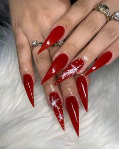 Red With White Design Nails, Red Christmas Nail Designs Stiletto, December Nail Ideas Stiletto, December Stilleto Nails, Christmas Nail Design Stiletto, Red Stelitto Nails Long, Xmas Stiletto Nails, Long Stiletto Christmas Nails, Stilleto Holiday Nails