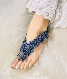 Blue Beaded Lace  Wedding Barefoot Sandals, Bridal Foot Jewelry, Footless Sandal, Vintage Lace Barefoot sandal, Handmade-SD018 These stunning Lt Ivory lace footless sandals are the perfect accessory for a beach or garden wedding. They are made with a lace applique and satin band. They are very comfortable and adjustable.  Model Size is US 7.5; sandal color is It ivory applique and ivory satin band . These sandals can  match the Light Ivory Beaded Lace Wedding Garter Set .  Lace applique color  has Lt ivory ,1/2" satin elastic band color has Ivory, white, blush,Lt blue . Measurement- Applique Size:6.5" Long, 1.5" wide.   Satin Elastic Band Band: approx  1/2"Wide Beaded Open Toe Sandals For Wedding, Blue Open Toe Barefoot Sandals For Party, Open Toe Blue Sandals For Wedding, Blue Open Toe Sandals For Wedding, Blue Beaded Open Toe Sandals, Adjustable Beaded Sandals For Wedding, Blue Ankle Strap Sandals For Wedding, Blue Barefoot Sandals For Summer Party, Adjustable Beaded Wedding Sandals