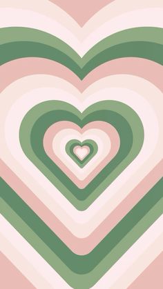 a heart shaped object in the middle of a pink, green and white background with stripes