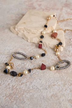 In an asymmetrical style, our lightweight Multi Bead Necklace is the perfect addition to any of our new Renaissance collection. Featuring a range of pearl-inspired beads in Rust and Neutral tones, this is elegant accessorising at its best. Elegant Long Necklace With Colorful Beads, Chic Beaded Necklace For Party, Chic Beaded Pearl Necklace, Elegant Multi-strand Pearl Necklace With Colorful Beads, Long Pearl Chain Beaded Necklace, Long Pearl Beaded Necklace For Party, Elegant Metal Beaded Necklace With Colorful Beads, Elegant Metal Beaded Necklace With Dangling Beads, Chic Pearl Necklace With Beaded Chain