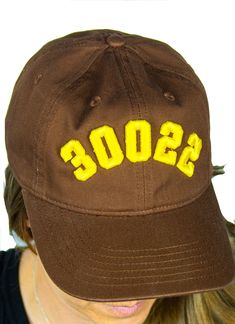 Customizable Code Caps Add your Zip Code or Area Code and we'll embroider the number in 3D puff for you.  Pick your hat color and the color thread that you want from our drop down list, and we'll ship your order out within 1 week.  100% organic cotton fiber. 6-panel, unstructured Self-fabric closure with brass slider and hidden tuck-in One size fits most. Area Codes, Drop Down List, Zip Code, In 3d, Trucker Cap, Cotton Fiber, Caps Hats, Accessories Hats, Organic Cotton