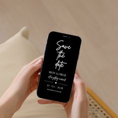 a person holding an iphone in their hand with save the date written on it's screen