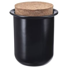 a black canister with a cork lid