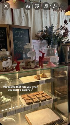 a display case filled with cakes and pastries